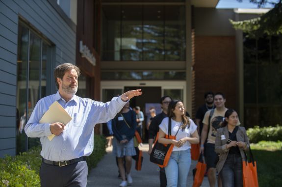 man in blue shirt gives a tour