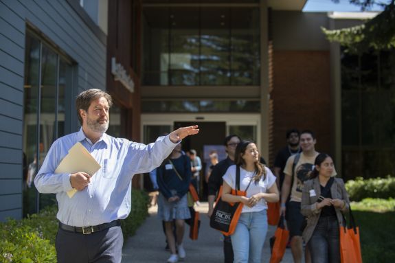 man in blue shirt gives a tour 