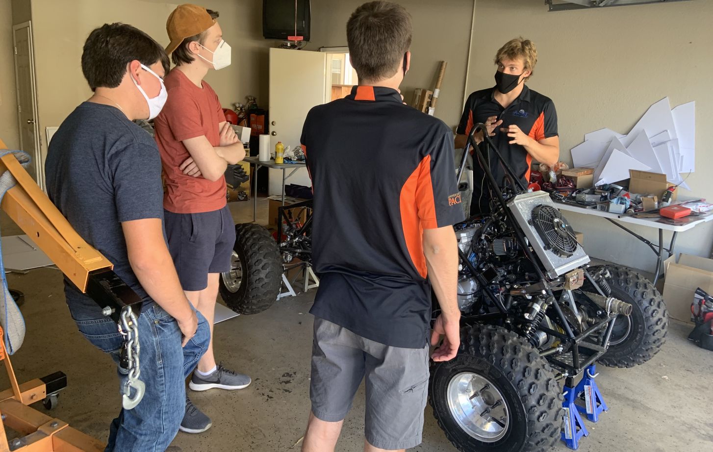 Students working on car