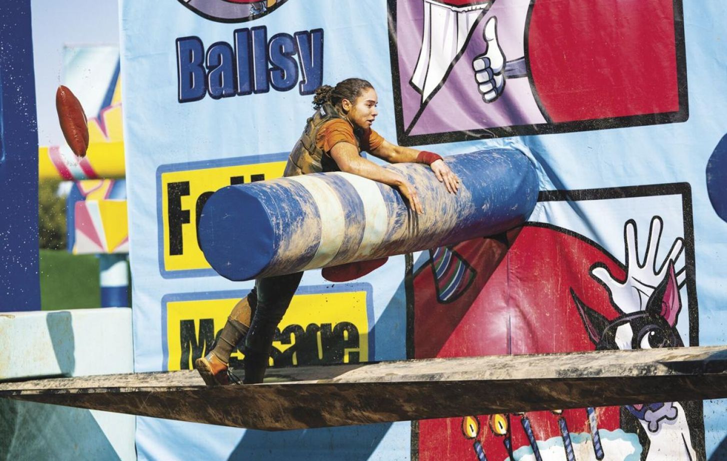 Brenna Crump '23 climbs obstacle course