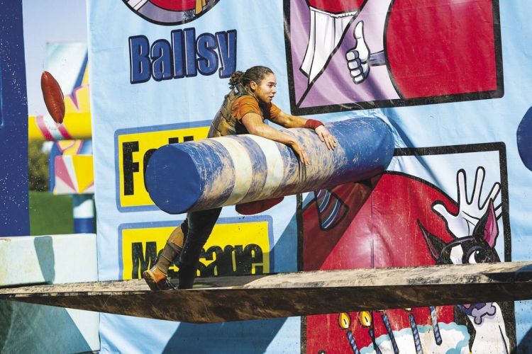 Brenna Crump '23 climbs obstacle course