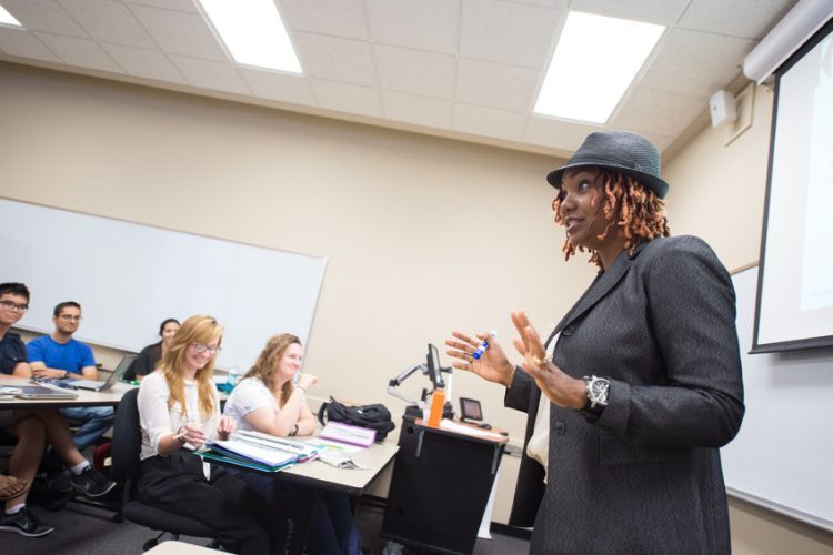 a professor lectures in front of a class